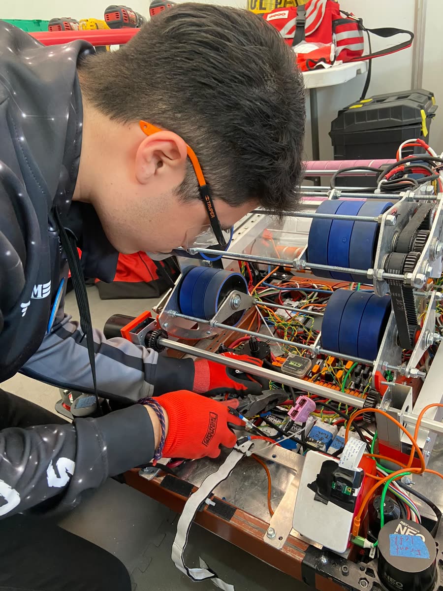 Hermes wiring a FIRST Robotics competition robot